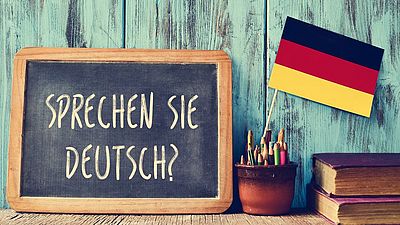 Ardoise affichant "Parlez-vous allemand?"