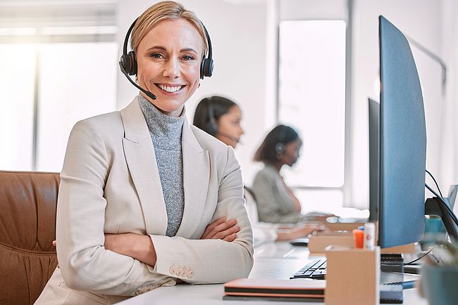 Woman working at the office in front of a computer